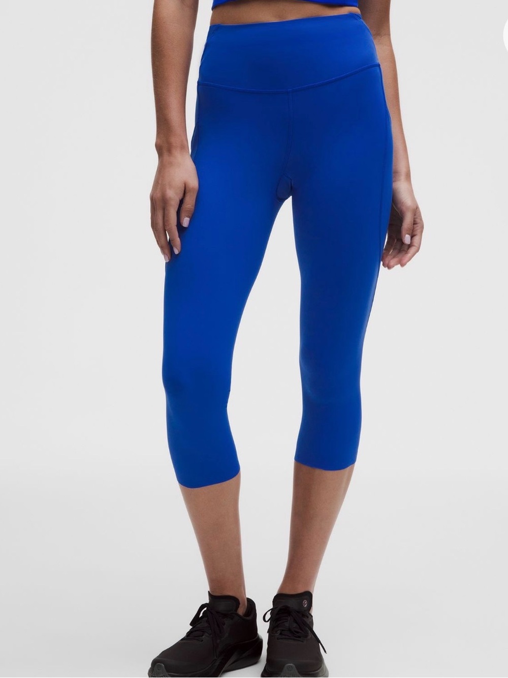 Lululemon Fast and Free high-rise crop leggings in a vibrant blue, reflective